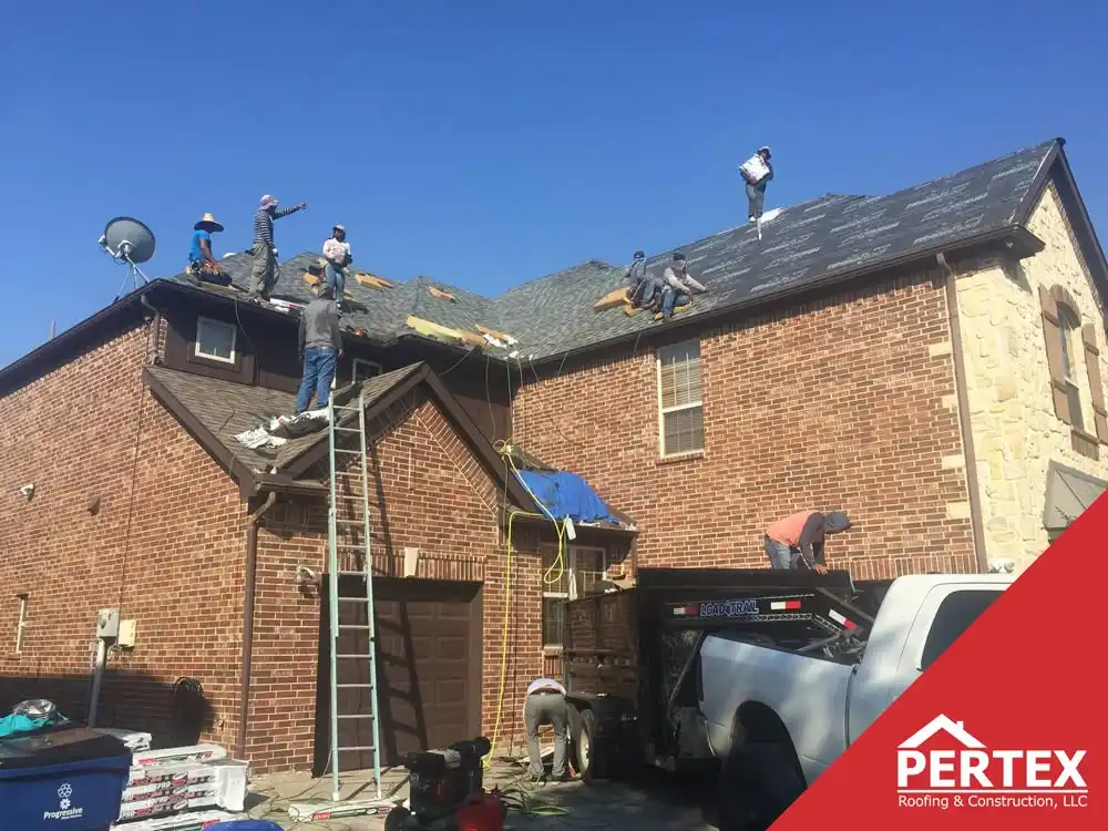 PERTEX roofing crew replacing shingle roof on brick home
