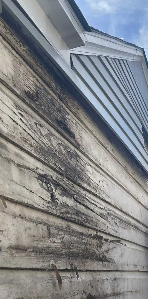 PERTEX crew removing rotted wood siding and installing new siding on Dallas Texas home