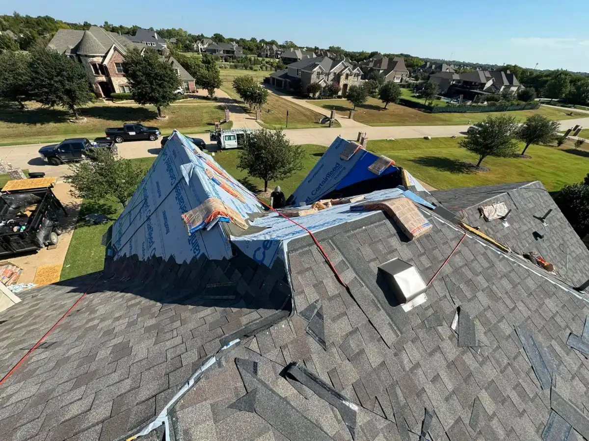 Steep residential roof with synthetic underlayment during tear-off
